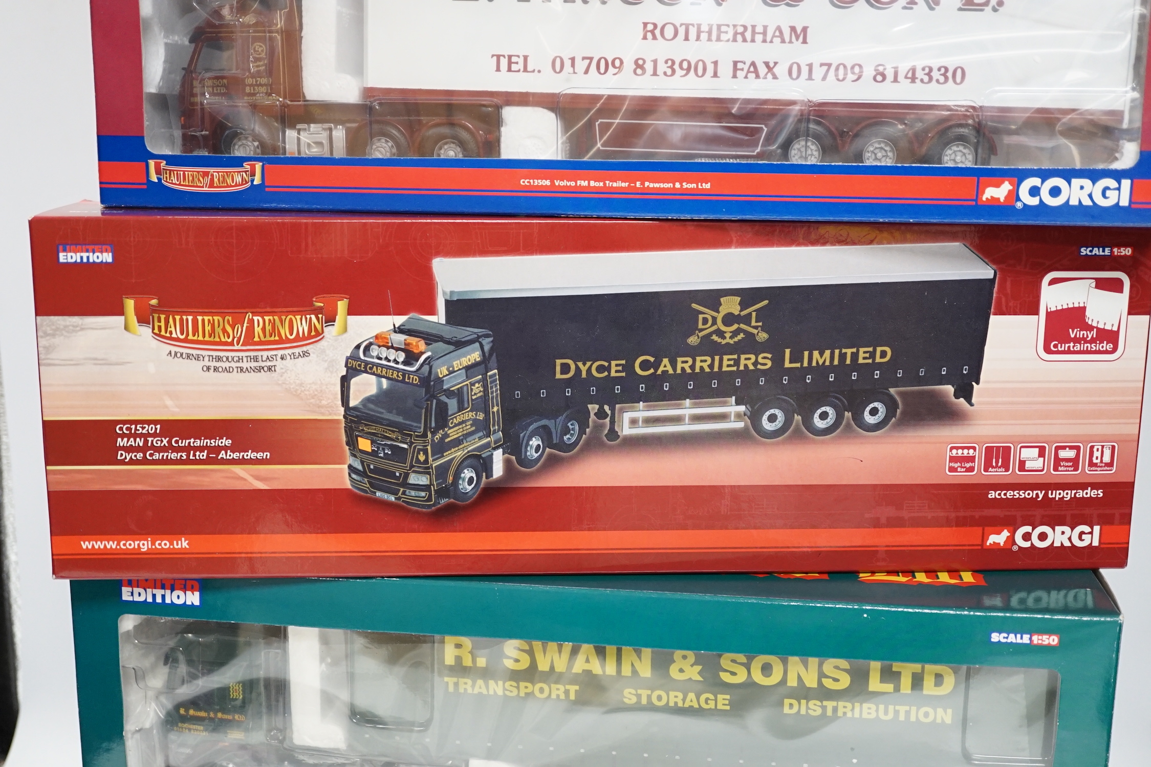 Four boxed Corgi 1:50 scale articulated trucks; a DAF CF curtainside (CC13601), a Volvo FM with box trailer (CC13506), a DAF XF Space Cab curtainside (CC13216), and a MAN TGX curtainside (CC15201)